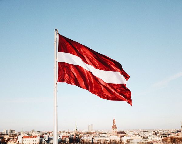 Latvijas karogs, Photo by Kaspars Upmanis on Unsplash