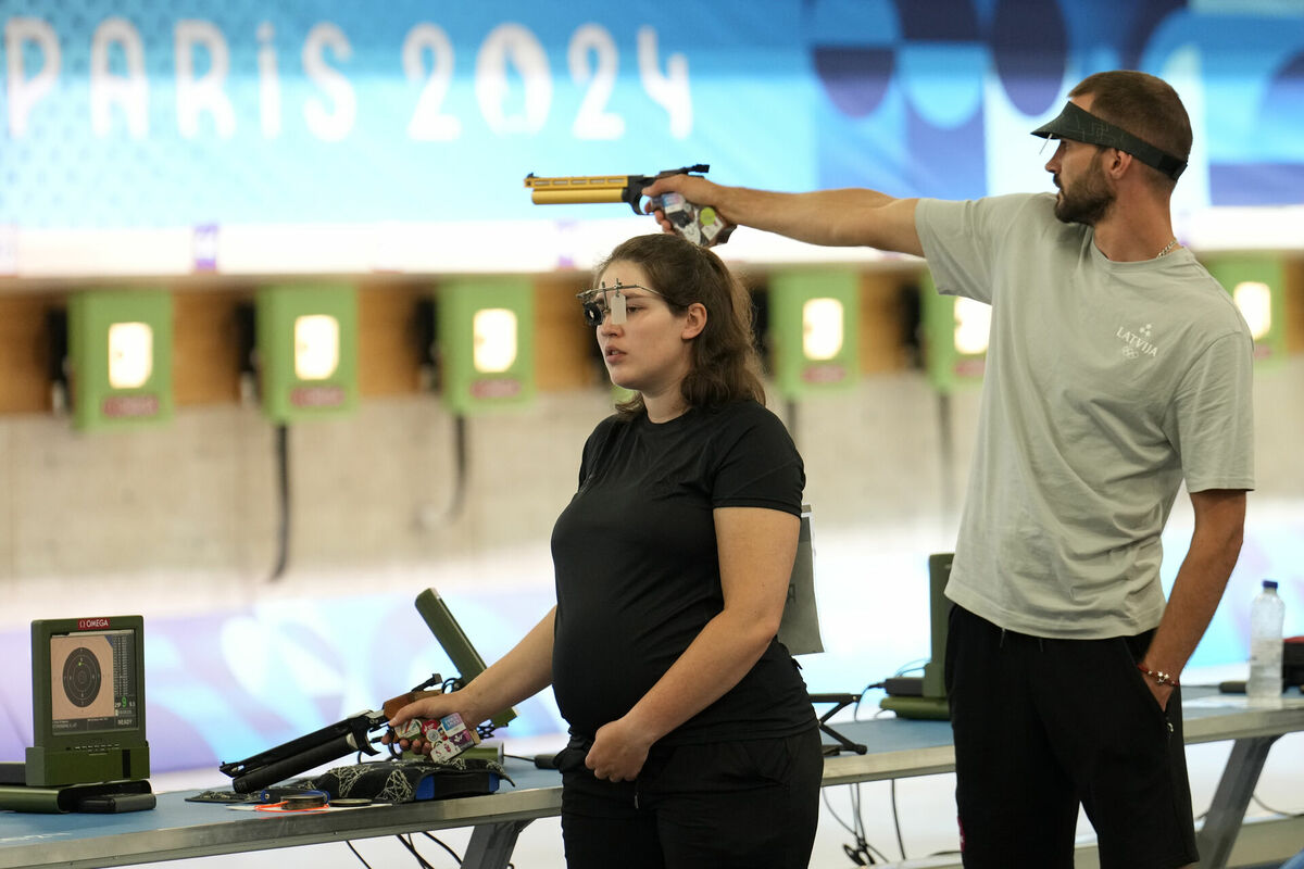 Agate Rašmane un Lauris Strautmanis. Foto: AP Photo/Manish Swarup/Scanpix